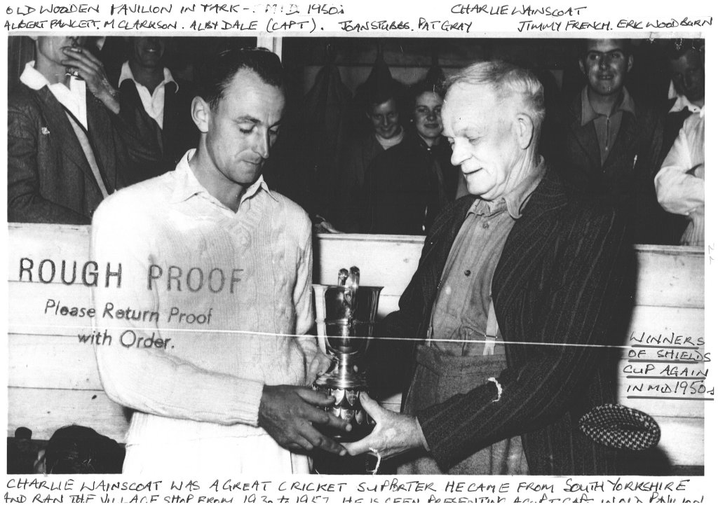 Charlie Wainscoat gives cup to the Captain
